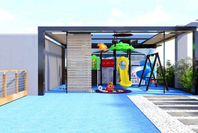 Children’s play area with a slide, swings and soft flooring
